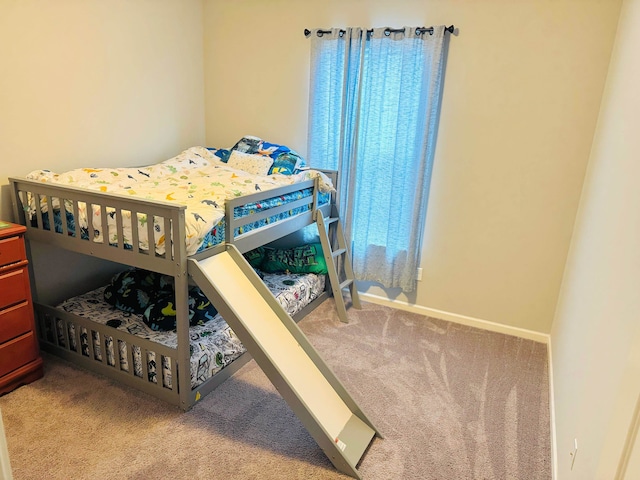 bedroom featuring light carpet