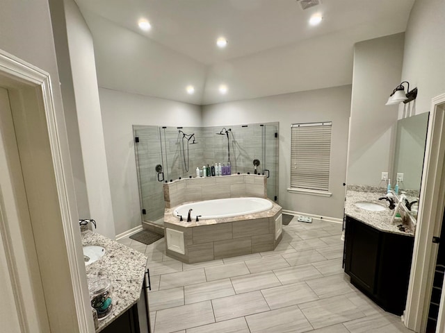 bathroom featuring vanity and separate shower and tub