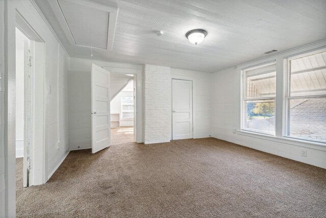 2186 Monroe Ave, Memphis, TN 38104 - unfurnished bedroom with attic access, carpet floors, and a closet