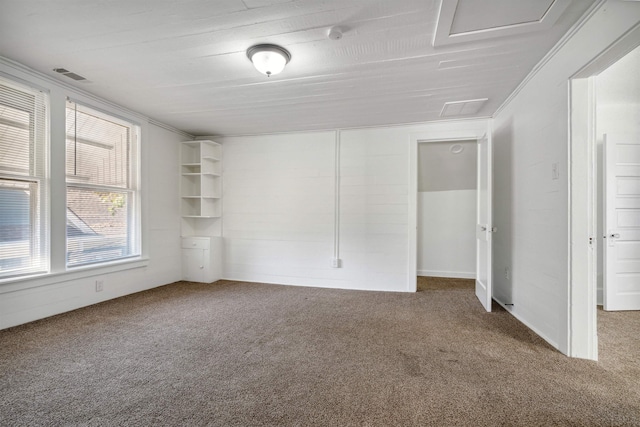 spare room featuring ornamental molding and carpet floors