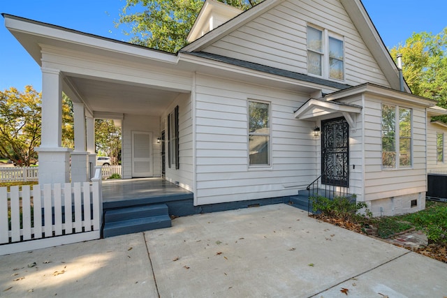 view of front of property featuring central air condition unit and a porch