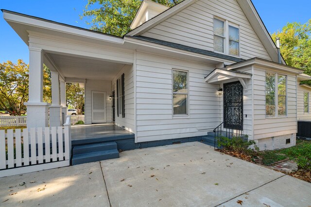 2186 Monroe Ave, Memphis, TN 38104 - view of front of home with crawl space, central air condition unit, and a porch