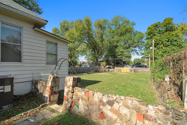 view of yard with central air condition unit