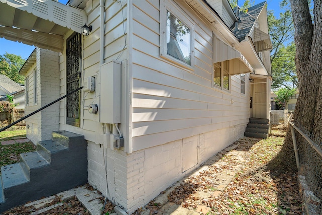 2186 Monroe Ave, Memphis, TN 38104 - view of home's exterior featuring entry steps and roof with shingles