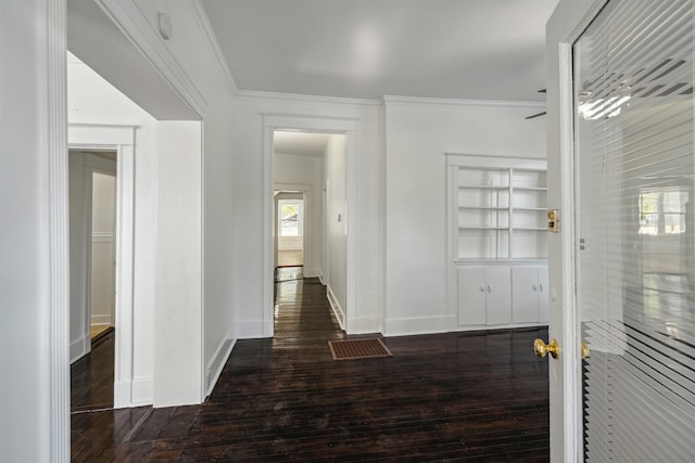 hall featuring crown molding and dark hardwood / wood-style floors