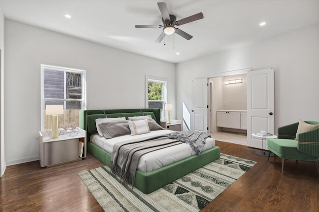 bedroom with ensuite bathroom, wood finished floors, ceiling fan, and recessed lighting