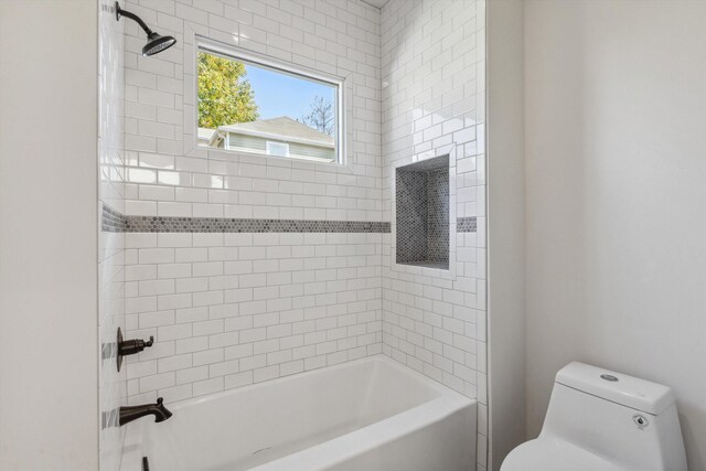 full bath featuring toilet and washtub / shower combination