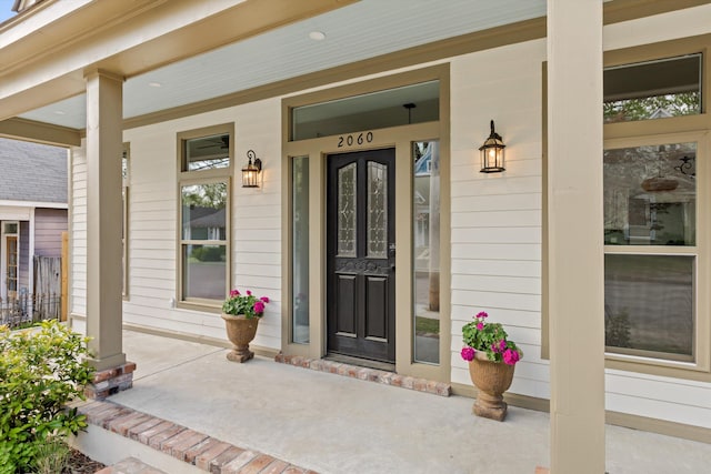 property entrance featuring a porch