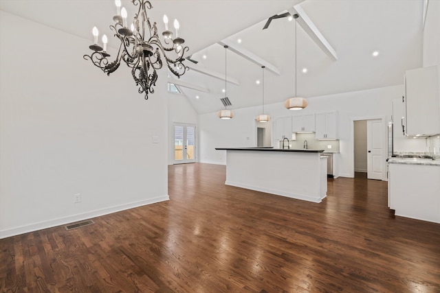 unfurnished living room with a sink, a chandelier, high vaulted ceiling, dark wood-type flooring, and beamed ceiling