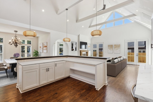 kitchen featuring dark wood-style floors, open floor plan, beamed ceiling, and high vaulted ceiling