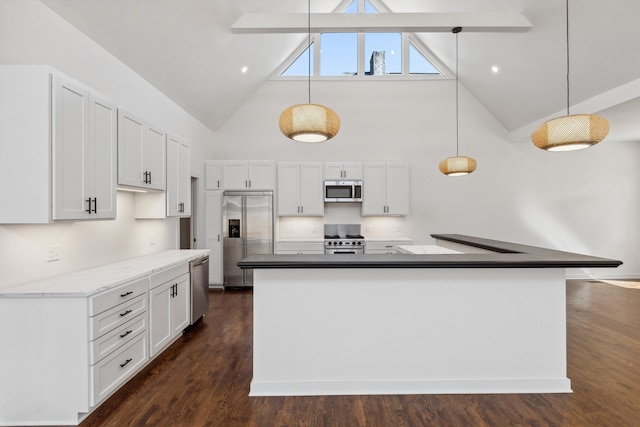 kitchen with white cabinets, high vaulted ceiling, high quality appliances, and decorative light fixtures