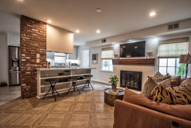 living room featuring a fireplace