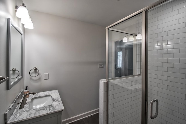 bathroom featuring vanity, tile patterned floors, and an enclosed shower