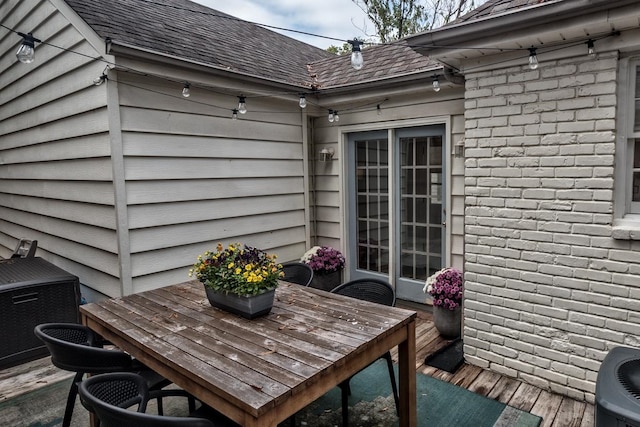 wooden deck with central air condition unit