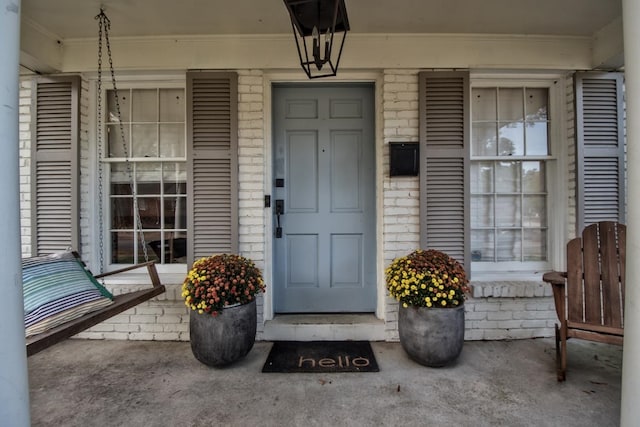 property entrance with covered porch