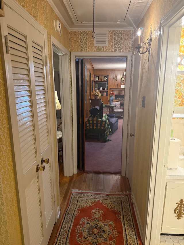 corridor featuring crown molding and wood-type flooring