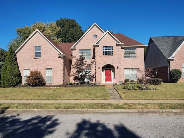 front facade with a front yard