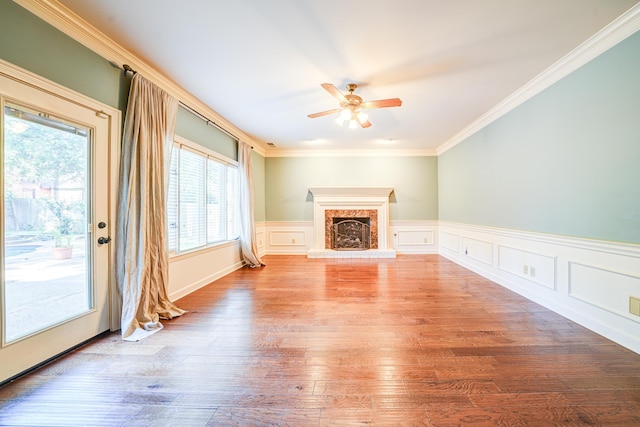 unfurnished living room featuring light hardwood / wood-style floors, crown molding, and ceiling fan