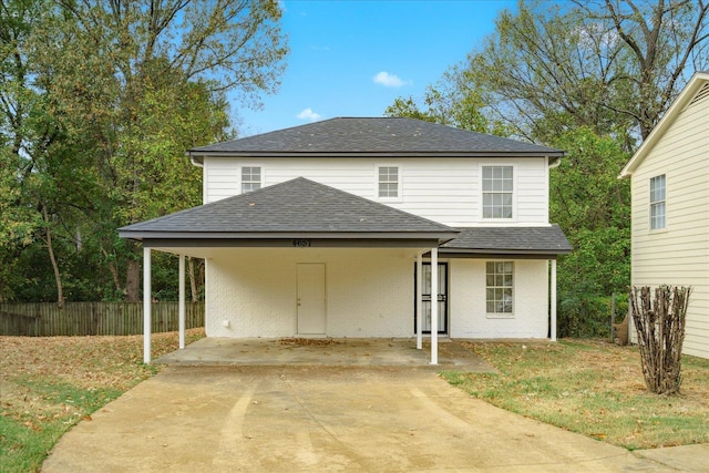 view of front of property with a carport