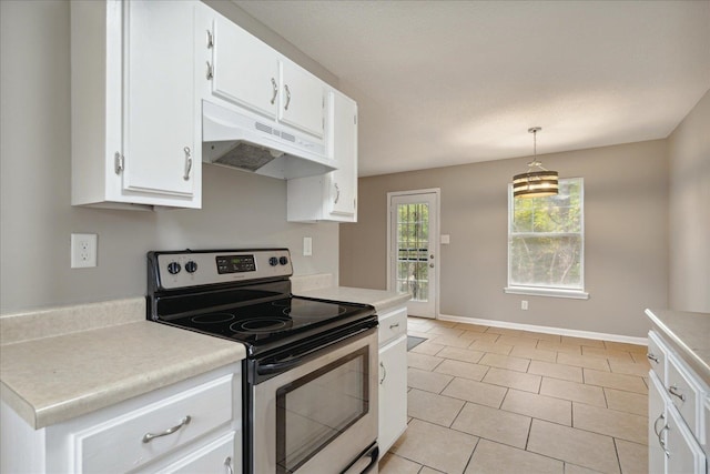 kitchen with stainless steel electric stove, light tile patterned floors, decorative light fixtures, and white cabinets