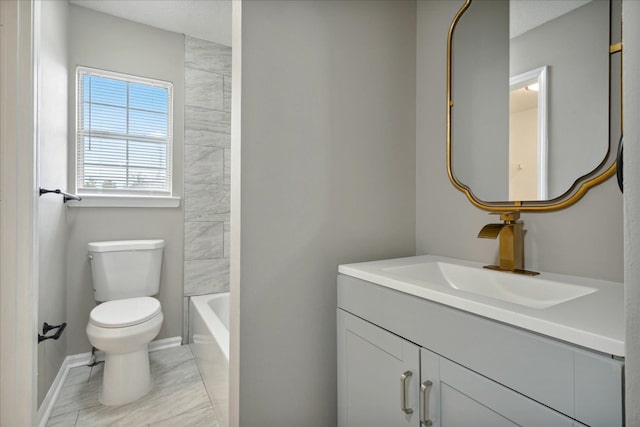 bathroom featuring vanity, a textured ceiling, and toilet