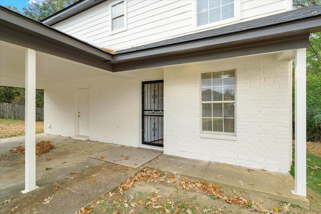 entrance to property featuring a patio area