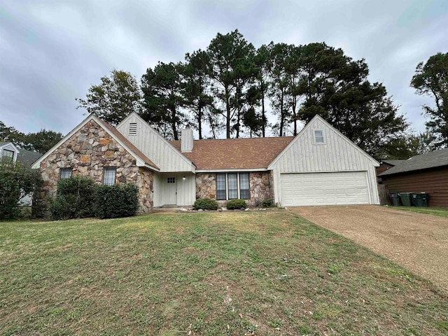 view of front of house with a front lawn and a garage