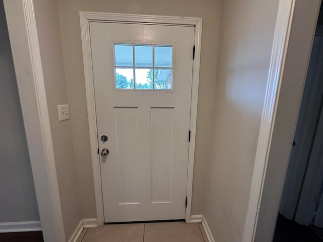 doorway featuring light tile patterned floors