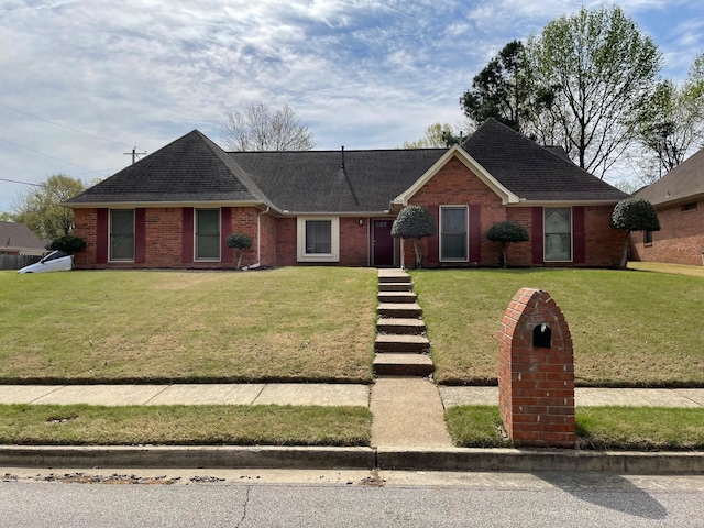 ranch-style home featuring a front yard