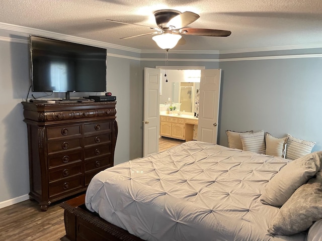 bedroom with ornamental molding, wood-type flooring, ceiling fan, and connected bathroom