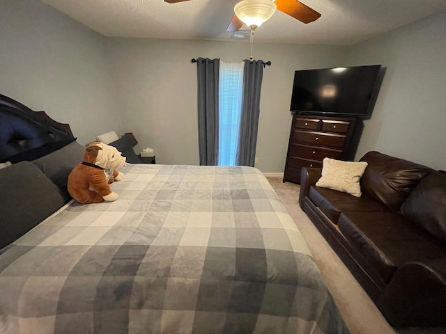 bedroom featuring ceiling fan and light carpet