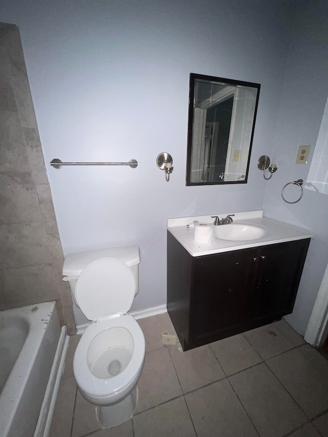 bathroom with vanity, toilet, a tub to relax in, and tile patterned flooring