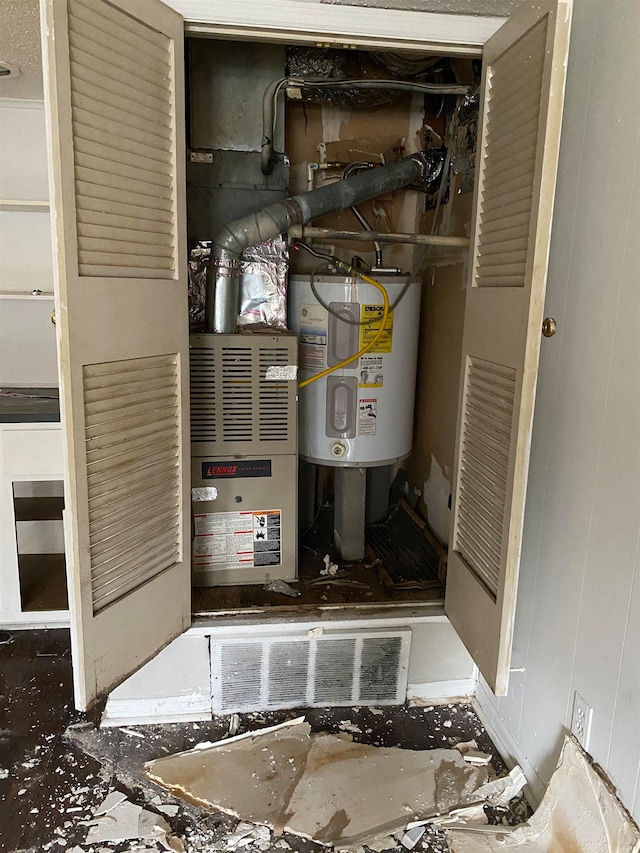 utility room featuring water heater