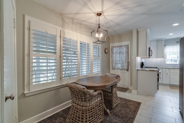 dining space featuring an inviting chandelier