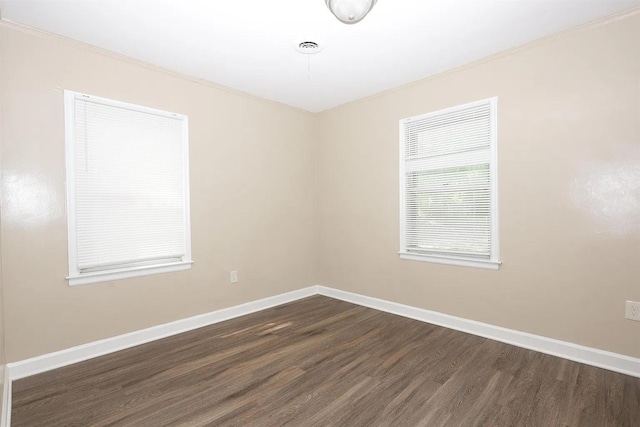 empty room with dark hardwood / wood-style floors