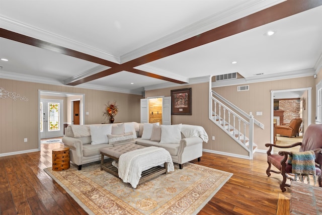 living room with beam ceiling, coffered ceiling, wood-type flooring, and ornamental molding