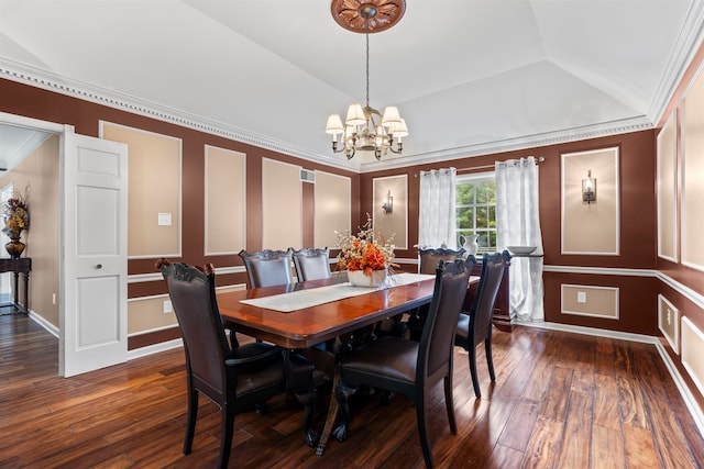 dining room featuring a notable chandelier, ornamental molding, lofted ceiling, and dark hardwood / wood-style flooring