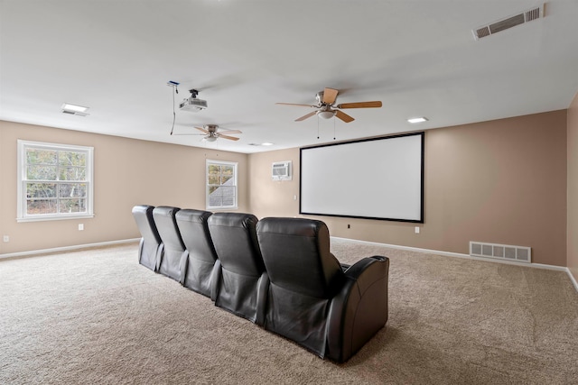 cinema with carpet flooring and ceiling fan