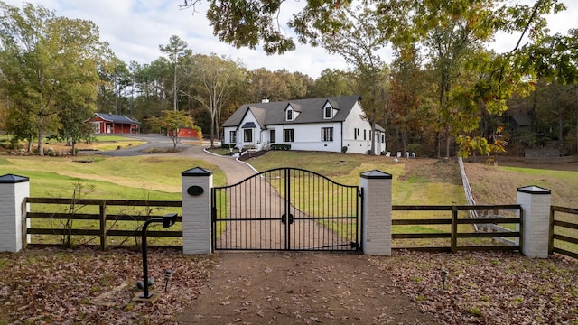 view of gate featuring a lawn