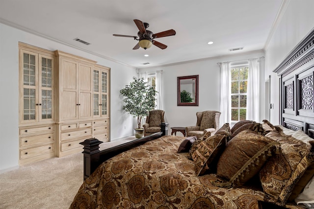 bedroom with ornamental molding, light carpet, and ceiling fan