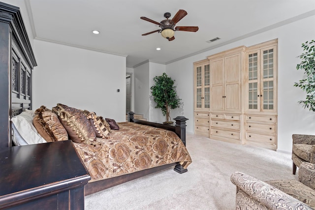 bedroom featuring crown molding, carpet, and ceiling fan