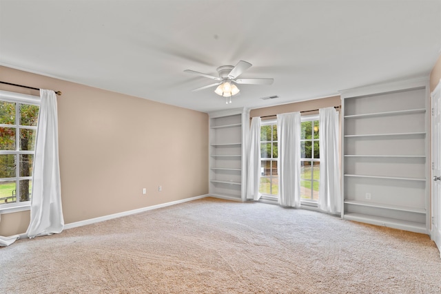 carpeted empty room with ceiling fan