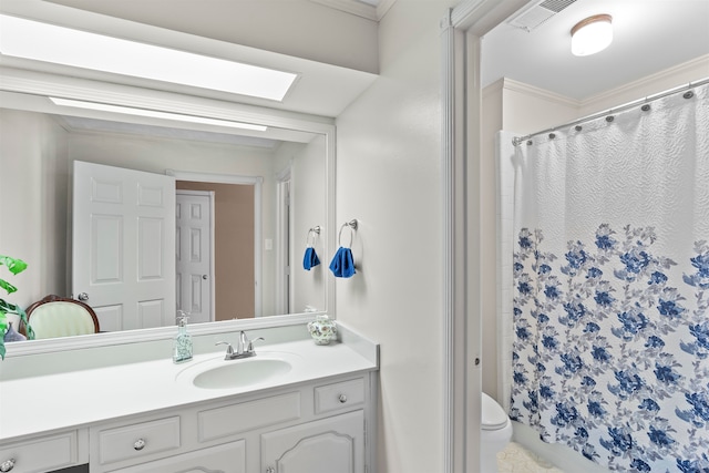 bathroom with vanity, toilet, ornamental molding, and a shower with curtain