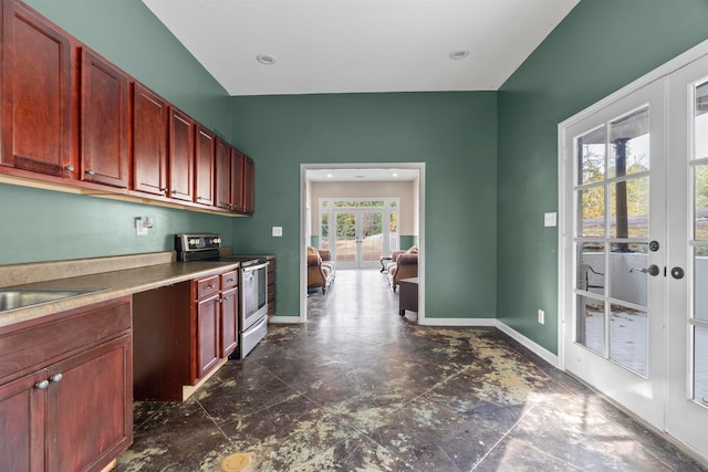 kitchen featuring sink, french doors, and stainless steel electric range