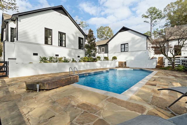 view of pool featuring a patio area