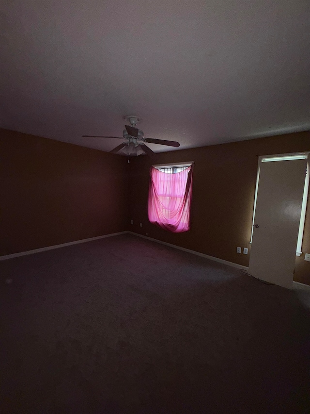 unfurnished room featuring carpet flooring and ceiling fan