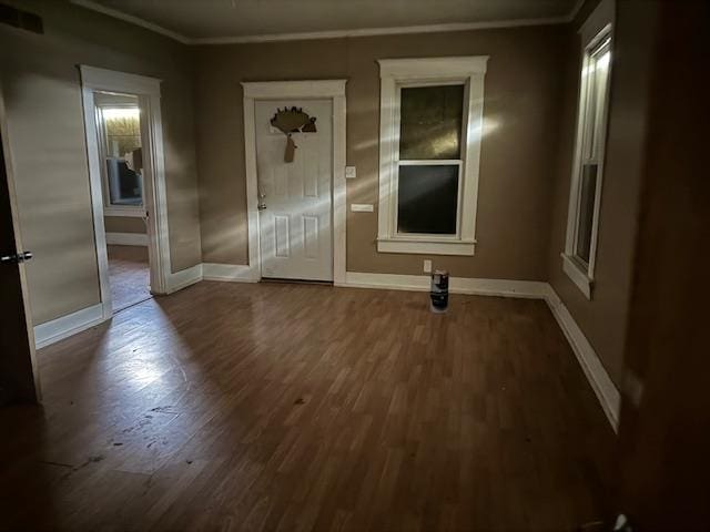 entrance foyer featuring hardwood / wood-style flooring and ornamental molding