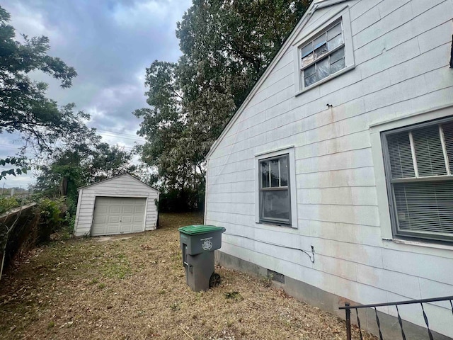 view of side of home with an outbuilding and a garage