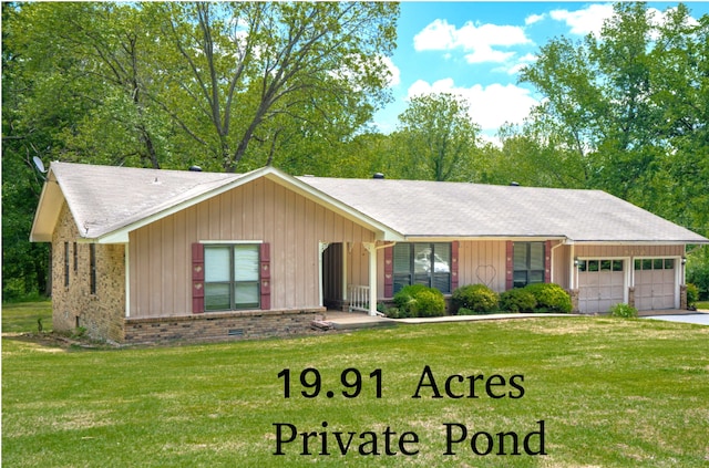 single story home featuring a front yard and a garage