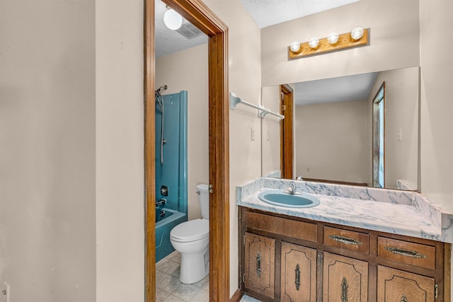 9430 Monasco Rd, Millington, TN 38053 - bathroom with toilet, vanity,  shower combination, and a textured ceiling